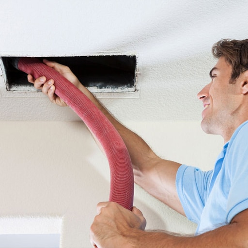 Worker cleaning vent
